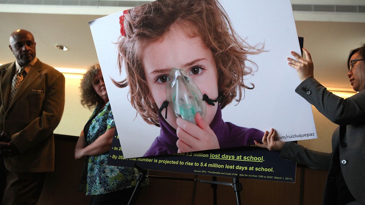 SAN FRANCISCO, CA - MARCH 23:  An aide for U.S. Sen. Barbara Boxer (D-CA) sets up a photograph of a child with asthma during a press conference on March 23, 2011 in San Francisco, California. U.S. Sen. Barbara Boxer held a press conference to emphasize the impacts H.R. 1, the Republicans' proposed budget.