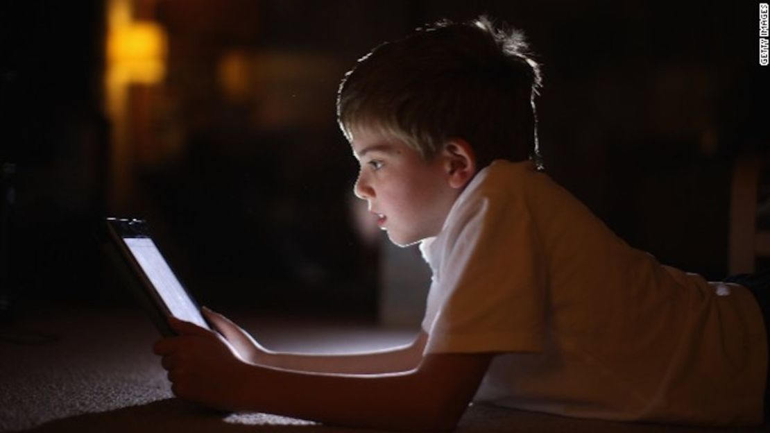 In this photograph illustration a ten-year-old boy uses an Apple Ipad tablet computer on November 29, 2011 in Knutsford, United Kingdom. Tablet computers have become the most wanted Christmas present for children between the ages of 6-11 years. Many parents are having to share their tablet computers with their children as software companies release hundredes of educational and fun applications each month.