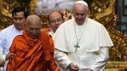 Pope Francis (R) attends a meeting with Bhaddanta Kumarabhivasma (L), Chairman of state Sanga Maha Nayaka Committee, in Yangon on November 29, 2017.
Pope Francis spread a message of forgiveness in a historic open-air mass before a sea of worshippers in Yangon on on November 29, during a visit to conflict-torn Myanmar that has been framed so far by his public sidestepping of the Rohingya crisis. / AFP PHOTO / Vincenzo PINTO