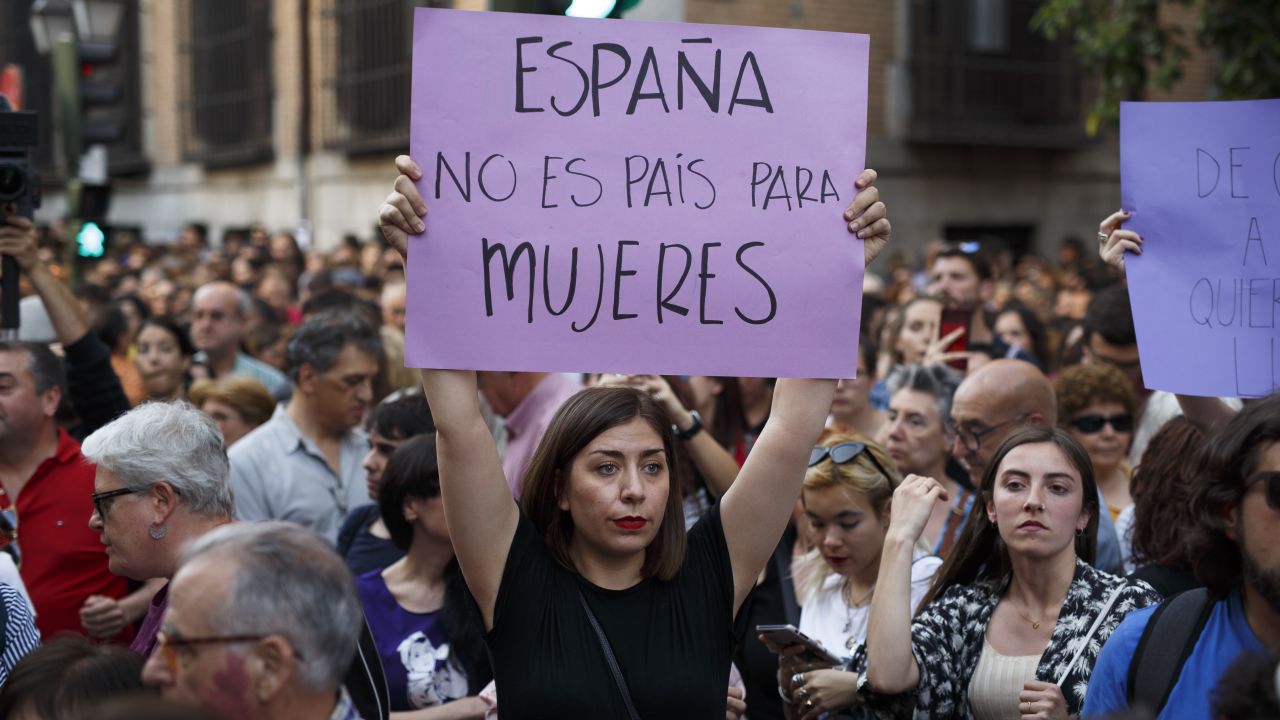 MADRID, SPAIN - APRIL 26:  A protester holds a placard reading 'Spain is not a country for women' during a demonstration against the verdict of the 'La Manada' (Wolf Pack) gang case outside the Minister of Justice on April 26, 2018 in Madrid, Spain. The High Court of Navarra has given a sentence of 9 years in prison to five men for 'continued sexual abuse' instead of 'rape', which would have seen them recieve around 22 years in prison. The gang assaulted an 18-year-old woman in Pamplona, during the San Fermin Festival in 2016. Feminists and women's rights groups have called for demonstrations across Spain.
