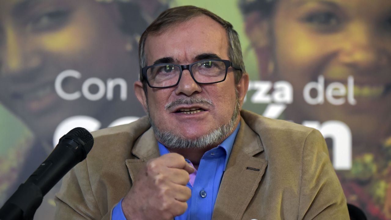 Rodrigo Londono Echeverri, known as "Timochenko", the presidential candidate for the Common Alternative Revolutionary Force (FARC) party, speaks during a press conference in Bogota, on February 28, 2018.
Londono delivered an S.O.S. message to save the pact of peace in the country, after he had to suspend his campaigns for political office, citing a lack of security safeguards. / AFP PHOTO / Raul ARBOLEDA