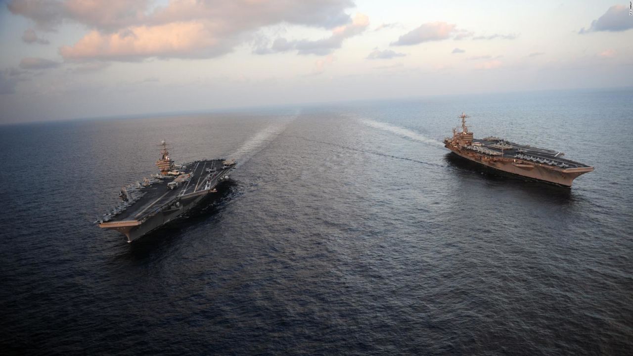 The Nimitz-class aircraft carriers USS Abraham Lincoln (CVN 72) and USS John C. Stennis (CVN 74) join for a turnover of responsibility in the Arabian Sea on Thursday, January 19, 2012. Both ships are deployed to the U.S. 5th Fleet area of responsibility.