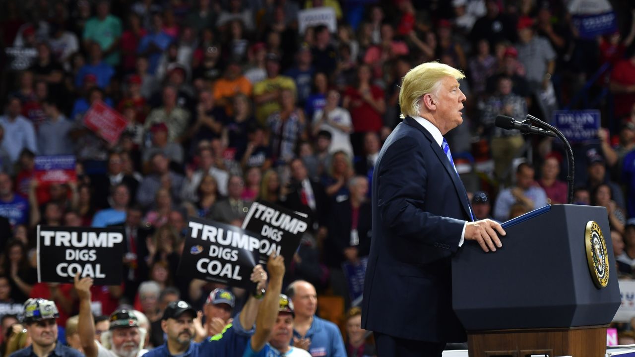 US President Donald Trump speaks at a political rally at Charleston Civic Center in Charleston, West Virginia, on August 21, 2018. - Trump's administration announced a plan on August 21 to weaken regulations on US coal plants, giving a boost to an industry that former leader Barack Obama had hoped to wind down in order to cut harmful emissions that drive global warming. (Photo by MANDEL NGAN / AFP)