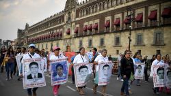 Relatives and comrades of the 43 students of the teaching training school in Ayotzinapa who went missing on September 2014 hold a demonstration to mark 43 months since their disappearance, in Mexico City on April 26, 2018. (Photo by YURI CORTEZ / AFP)