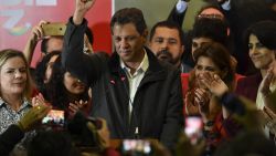 Brazil's presidential candidate for the Workers' Party (PT), Fernando Haddad gestures after the first round of the general elections at the Workers' Party (PT) headquarters, in Sao Paulo, Brazil, on October 7, 2018. - Polarizing far-right politician Jair Bolsonaro was the big winner of a first-round presidential election in Brazil on Sunday, according to virtually complete results -- but a final victory in a run-off to be held in three weeks is far from assured. (Photo by NELSON ALMEIDA / AFP)