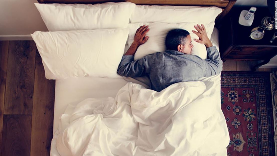 CNNE 594092 - french man sleeping alone on bed; shutterstock id 1070512514; job- sleep