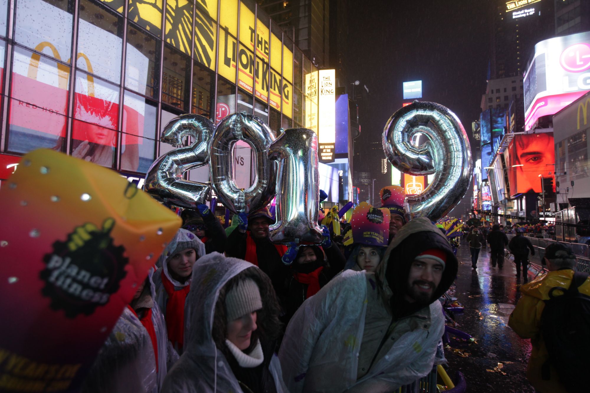 CNNE 601208 - revelers celebrate new year's eve in new york's times square