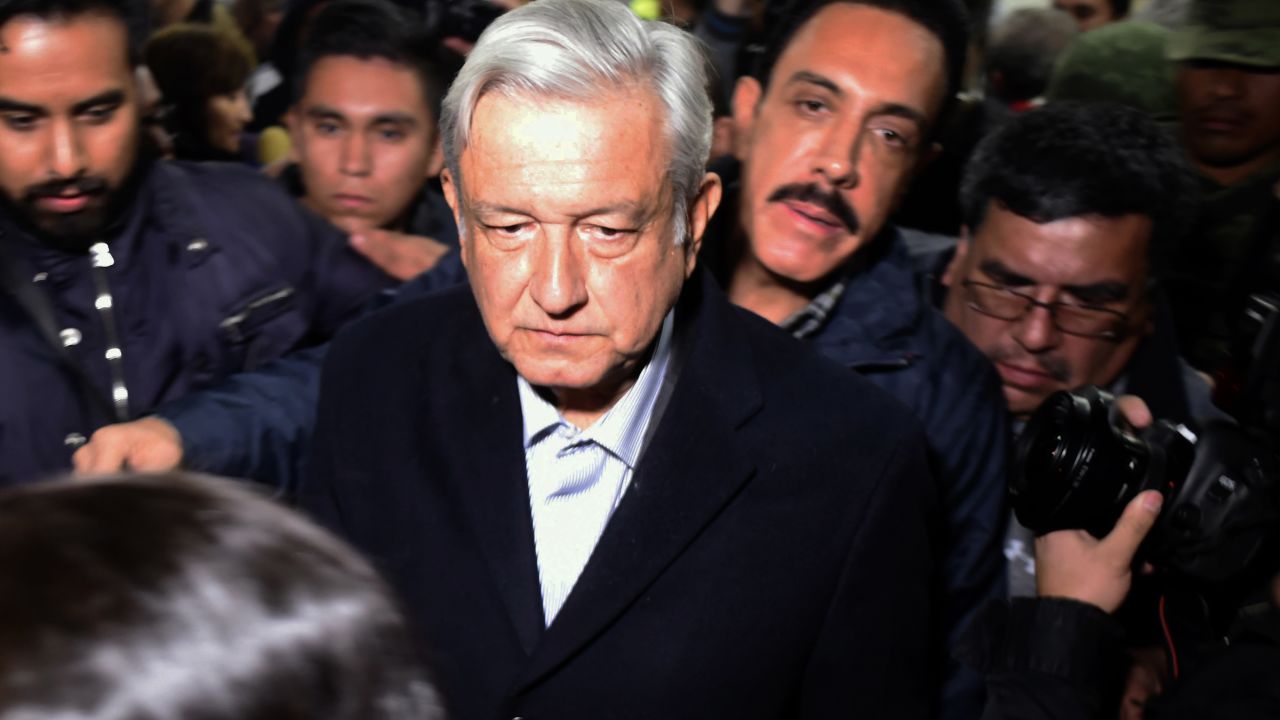 Mexican President Andres Manuel Lopez Obrador (C) arrives in Tlahuelilpan, after a leaking gas pipeline triggered a blaze, Hidalgo state, Mexico, on January 19, 2019. - A leaking fuel pipeline triggered a massive blaze in central Mexico, killing at least 20 people and injuring another 54, officials said. Omar Fayad, governor of Hidalgo state, said locals at the site of the leak were scrambling to steal some of the leaking oil when at least 20 of them were burned to death. (Photo by ALFREDO ESTRELLA / AFP)