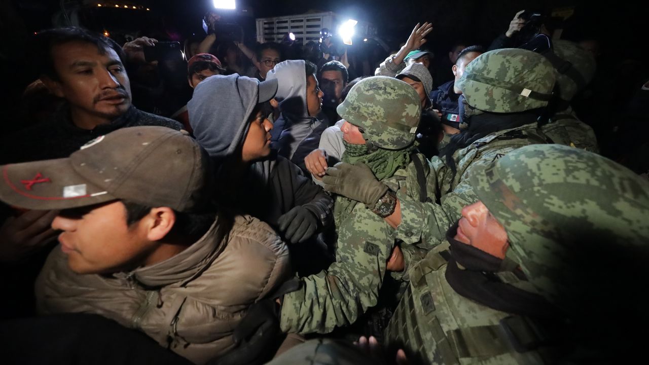 TLAHUELILPAN, MEXICO - JANUARY 19: Villagers argue with the military to let them go to look for their missing relatives after an explosion in a pipeline belonging to Mexican oil company PEMEX on January 19, 2019 in Tlahuelilpan, Mexico. In a statement PEMEX announced that the explosion was caused by the illegal manipulation of the pipeline, minutes before the accident, some videos were shot where people could be seen filling drums, even car fuel tanks.