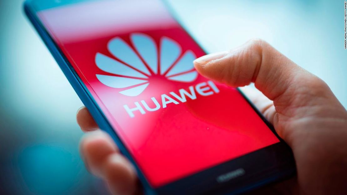 BERLIN, GERMANY - JANUARY 15: A Woman holding a mobile device with a Huawei logo is seen in this photo illustration on January 15, 2019.