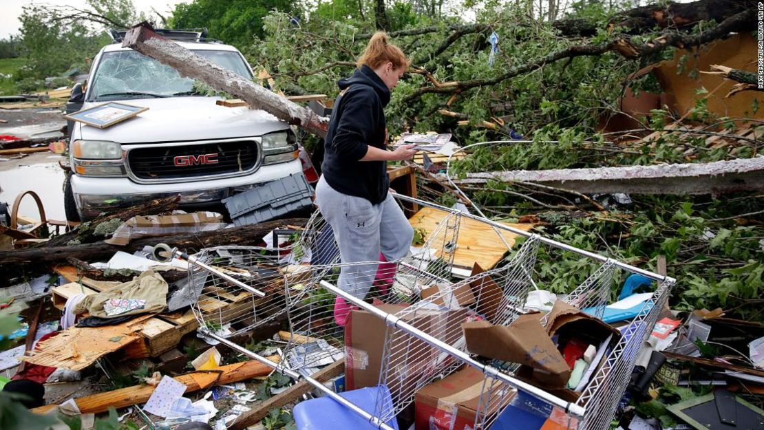 Michelle Underwood searches through the wreckage of a feed store in Peggs, Ok. where she stored most of her belingings Tuesday, May 21, 2019. An apparent tornado hit the area Monday night. MIKE SIMONS/Tulsa World