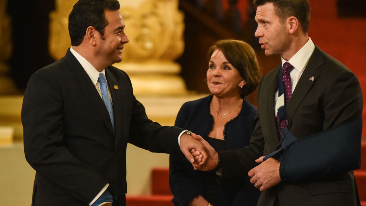 Guatemalan President Jimmy Morales(L) shakes hands with US Acting Secretary of Homeland Security Kevin McAleenan (R) after signing a cooperation agreement at Culture Palace in Guatemala City on May 27, 2019. (Photo by Johan ORDONEZ / AFP)