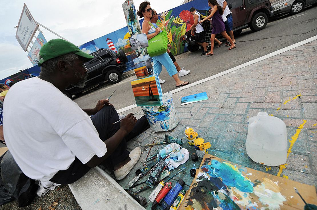 CNNE 698480 - street painter jeff lewis works on a pai