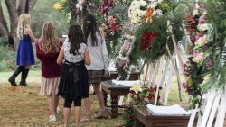 Girls attend the wake of Dawna Ray Langford and two of her children, who were among nine victims killed on Monday in a hail of bullets in an attack authorities have blamed on a drug cartel, at La Mora Ranch in the municipality of Bavispe, Sonora State, Mexico, on November 7, 2019. - Mexico alleged on November 6 that a drug cartel called "La Linea" massacred nine Mormon women and children in a case of mistaken identity, but devastated relatives insisted their loved ones were deliberately targeted. (Photo by Herika Martinez / AFP)