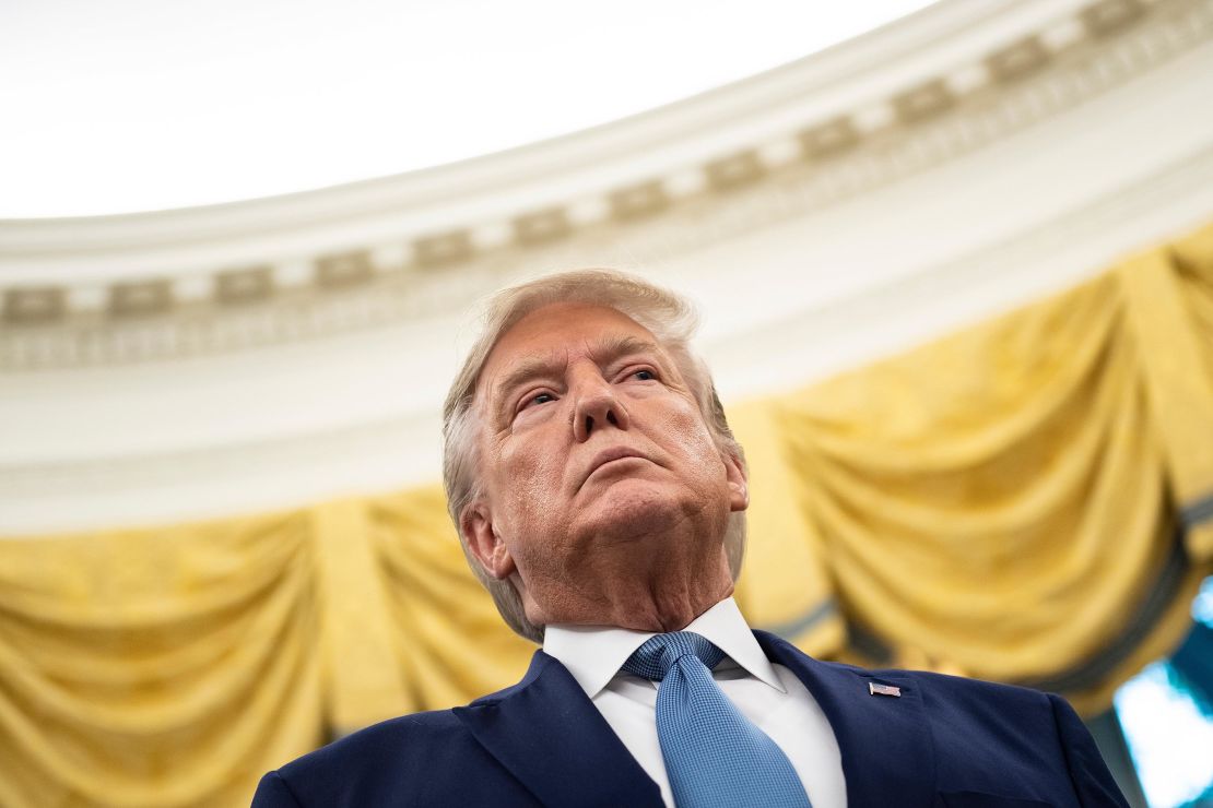 US President Donald Trump listens during a Presidential Medal of Freedom ceremony for Edwin Meese in the Oval Office at the White House in Washington, DC on October 8, 2019. (Photo by Brendan Smialowski / AFP)