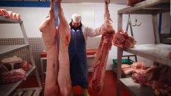 Cuts of meat hang inside a meat wholesalers at Liverpool Wholesale Meat Market on February 14, 2013 in Liverpool, England.  British high street butchers are enjoying a resurgence in their popularity since the horsemeat food scandal broke, reporting a sharp increase in sales of freshly cut meat.