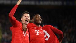 LONDON, ENGLAND - FEBRUARY 25: Robert Lewandowski of Bayern Munich celebrates with David Alaba after he scores his team's third goal during the UEFA Champions League round of 16 first leg match between Chelsea FC and FC Bayern Muenchen at Stamford Bridge on February 25, 2020 in London, United Kingdom.