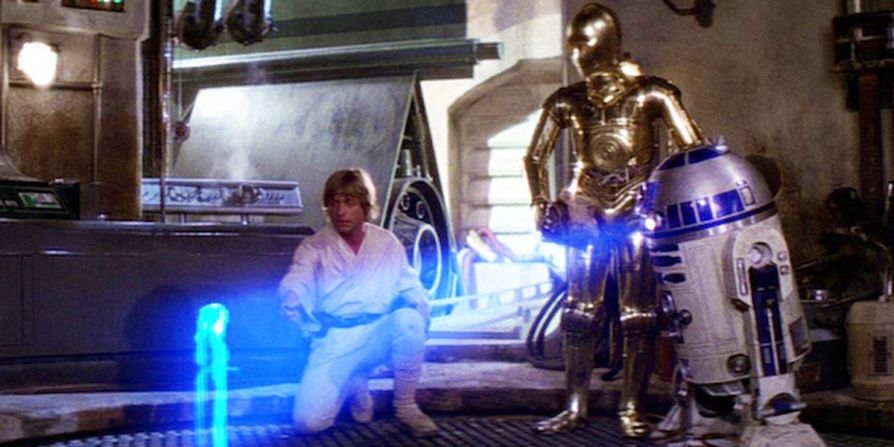 La proyección holográfica de la princesa Leia pidiendo ayuda a Obi-Wan Kenobi en la película original de "Star Wars" (1977) inicia la narrativa de la película, llevando a Luke Skywalker a un viaje a través de galaxias muy, muy lejanas... Lucasfilm / Disney