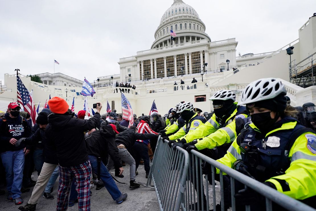 Trump ers try to break through a police barrier, Wednesday, Jan. 6, 2021, at the Capitol in Washington. As Congress prepares to affirm President-elect Joe Biden's victory, thousands of people have gathered to show their for President Donald Trump and his claims of election fraud.