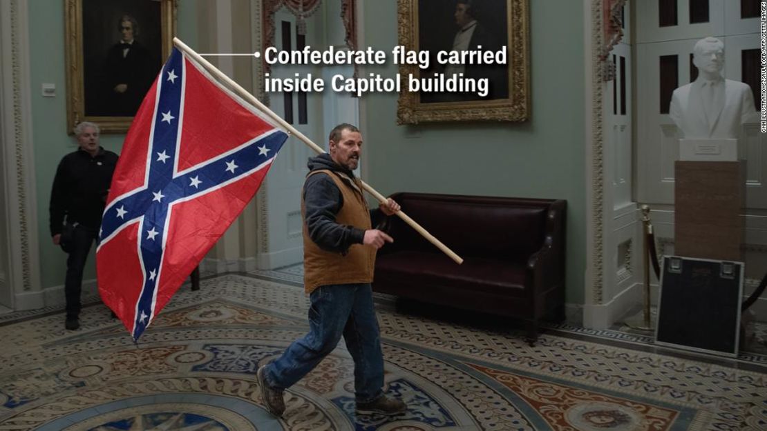 CNNE 937771 - 210108211312-06-capitol-hill-extremist-flags-confederate-flag-jpg-super-169