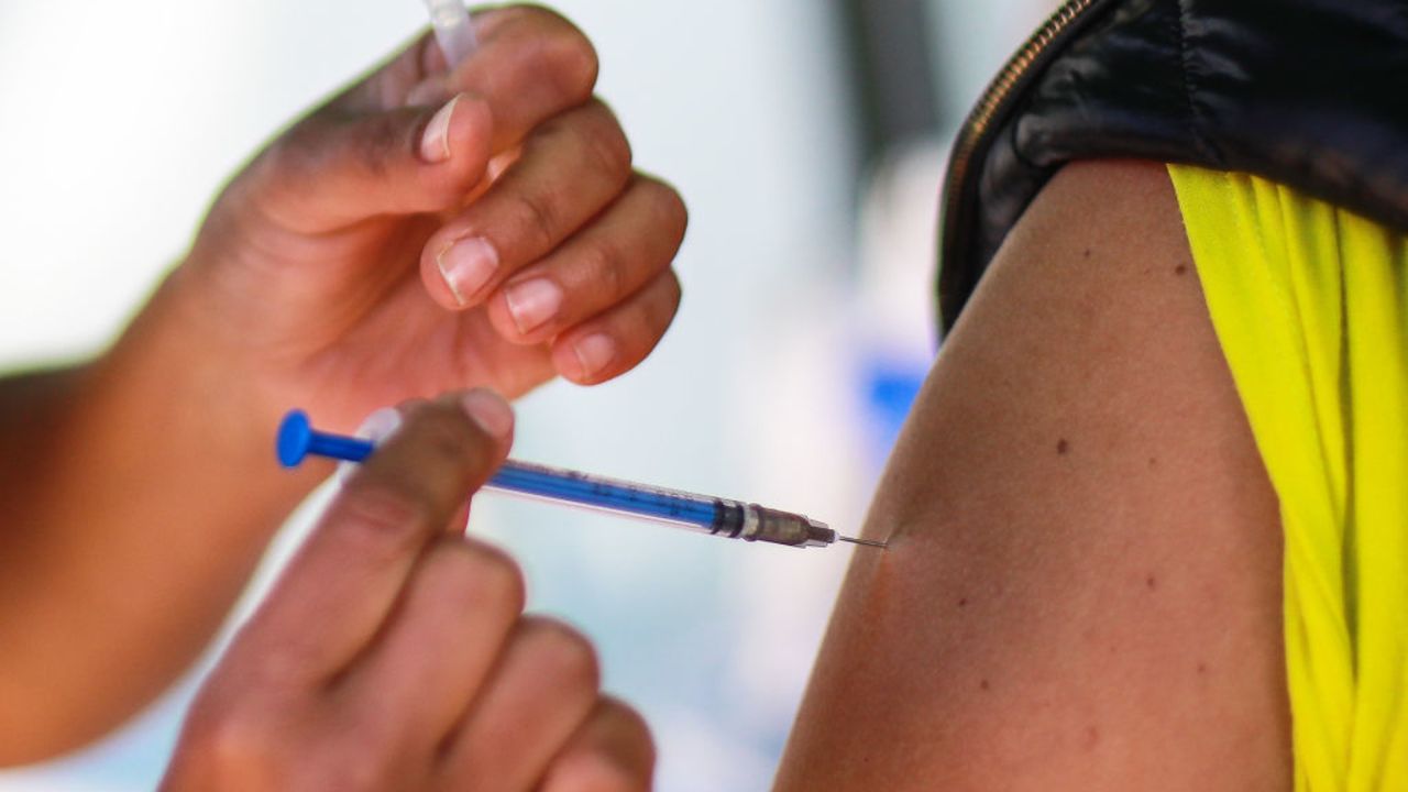 MEXICO CITY, MEXICO - DECEMBER 28: A medical worker receives the Pfizer/BioNTech vaccine as part of Mexico COVID-19 vaccination plan at 81st Infantry Batallion facilities on December 28, 2020 in Mexico City, Mexico.