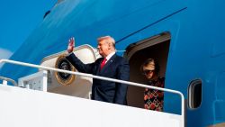 Outgoing US President Donald Trump and First Lady Melania Trump exit Air Force One as they arrive at Palm Beach International Airport in West Palm Beach, Florida, on January 20, 2021. - President Trump and the First Lady travel to their Mar-a-Lago golf club residence in Palm Beach, Florida, and will not attend the inauguration for President-elect Joe Biden. (Photo by ALEX EDELMAN / AFP)