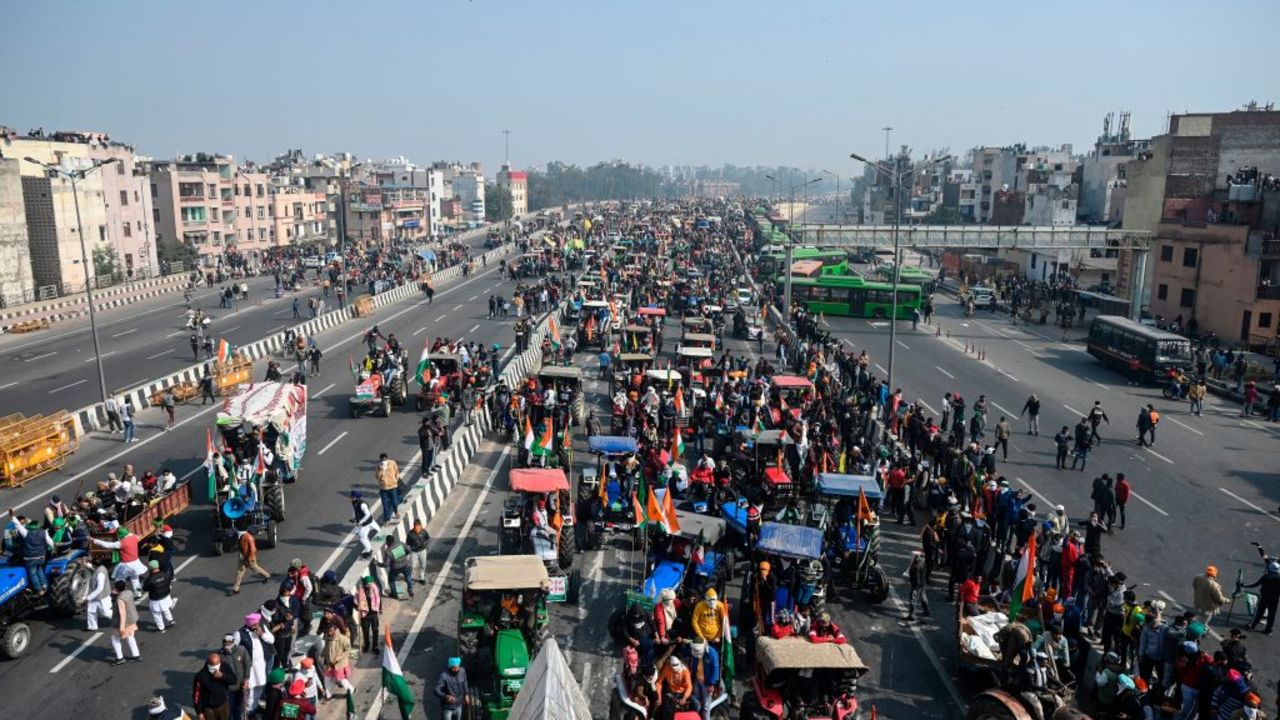 Farmers take part in a rally as they continue to protest against the central government's recent agricultural reforms, in New Delhi on January 26, 2021. (Photo by Sajjad HUSSAIN / AFP)