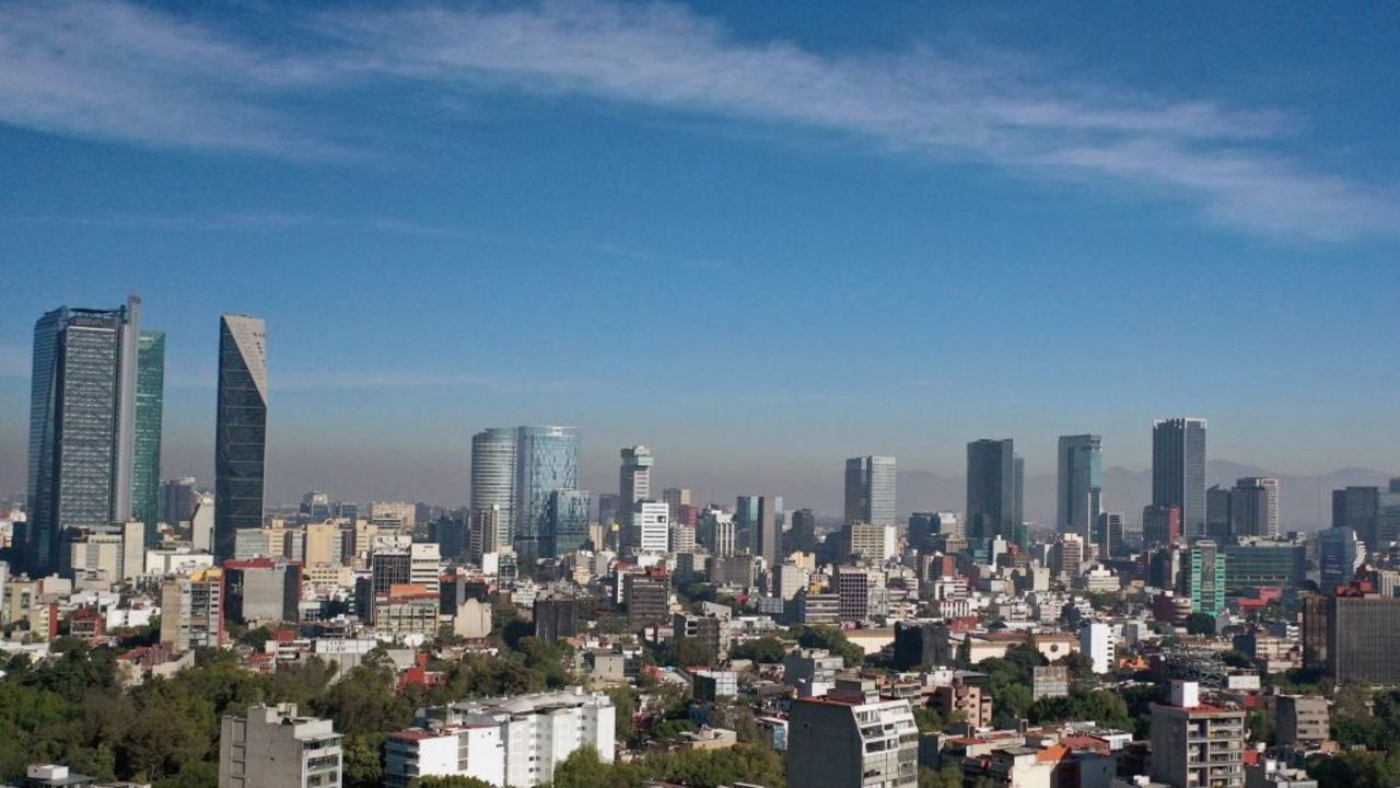 Aerial view showing low visibility due to air pollution in Mexico City, on January 1, 2021, during the COVID-19 coronavirus pandemic. (Photo by ALFREDO ESTRELLA / AFP)