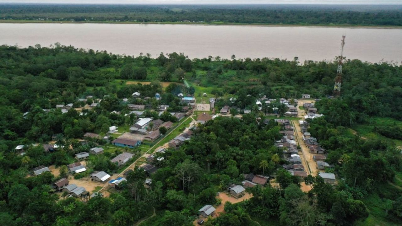 Aerial view of the Nazareth Reservation community, near Leticia, Amazonas department, Colombia on November 20, 2020. - Located on the banks of the Amazon river, an hour away by boat from Leticia, the capital of the Colombian department of Amazonas, the indigenous settlement of Nazareth of 1,035 inhabitants is one, if not the only, to accept homosexuals. (Photo by Raul ARBOLEDA / AFP)