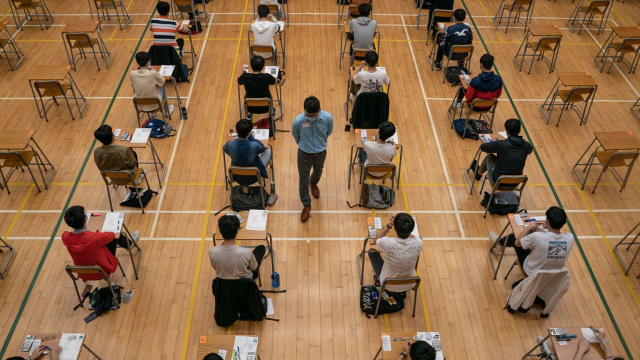 HONG KONG, CHINA - APRIL 26: Students sit for the Diploma of Secondary Education (DSE) exams on April 26, 2021 in Hong Kong, China. Temperature checks and social distancing measures to avoid the spread of COVID-19 have have been put in place in the schools for over 50,000 candidates who will sit for the DSE examination this year.