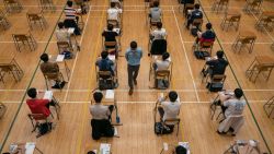 HONG KONG, CHINA - APRIL 26: Students sit for the Diploma of Secondary Education (DSE) exams on April 26, 2021 in Hong Kong, China. Temperature checks and social distancing measures to avoid the spread of COVID-19 have have been put in place in the schools for over 50,000 candidates who will sit for the DSE examination this year.