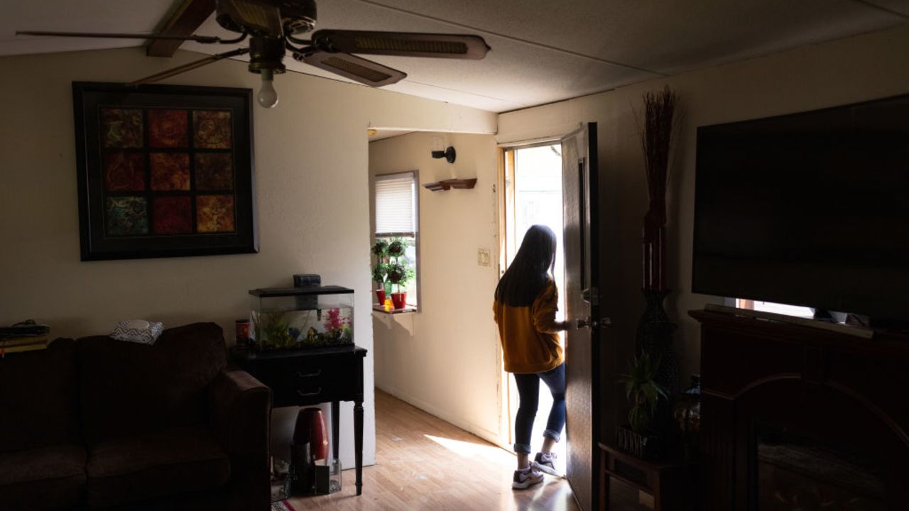 SELLERSBURG, INDIANA - APRIL 25: Honduran immigrant Nani, 10, helps clean house after moving in with her extended family on April 25, 2021 in Sellersburg, Indiana. She had been released two days before from U.S. Health and Human Services (HHS) custody as an unaccompanied minor after spending nearly eight weeks in shelters, the last one in New York City. Originally Nani had traveled with her mother from Honduras and crossed the Rio Grande from Mexico together, but they were immediately deported under Title 42 pandemic rules, according to the non-profit Every. Last. One, which facilitates reunifying children with families in the U.S. On March 1 her mother then sent the girl alone as an unaccompanied minor across the river with a smuggler, as such children are allowed entry into the U.S. under current Biden administration rules. As of April 21, HHS reports holding more than 21,000 children, most from Central America, in their custody pending placement with the their families or sponsors living in the U.S. Many of the minors, like Nani, had previously crossed the border with family members and been deported before being sent back across as unaccompanied minors by desperate parents. According to the girl's aunt Saiyda Gonzalez, Nani's mother remains in Mexico, hoping to again try and cross into the U.S.