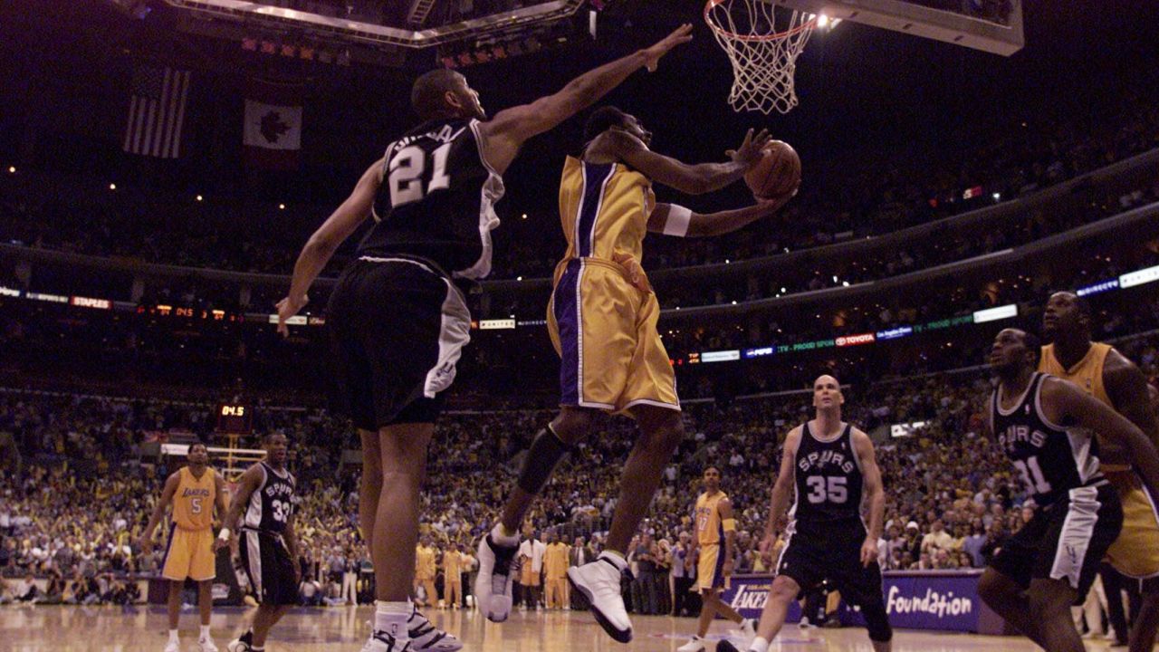 25 May 2001:   Kobe Bryant #8 of the Los Angeles Lakers puts a shot up against Tim Duncan #21 of the San Antonio Spurs in game three of the western conference finals at Staples Center in Los Angeles.  DIGITAL IMAGE.  Mandatory Credit: Donald Miralle/Allsport.