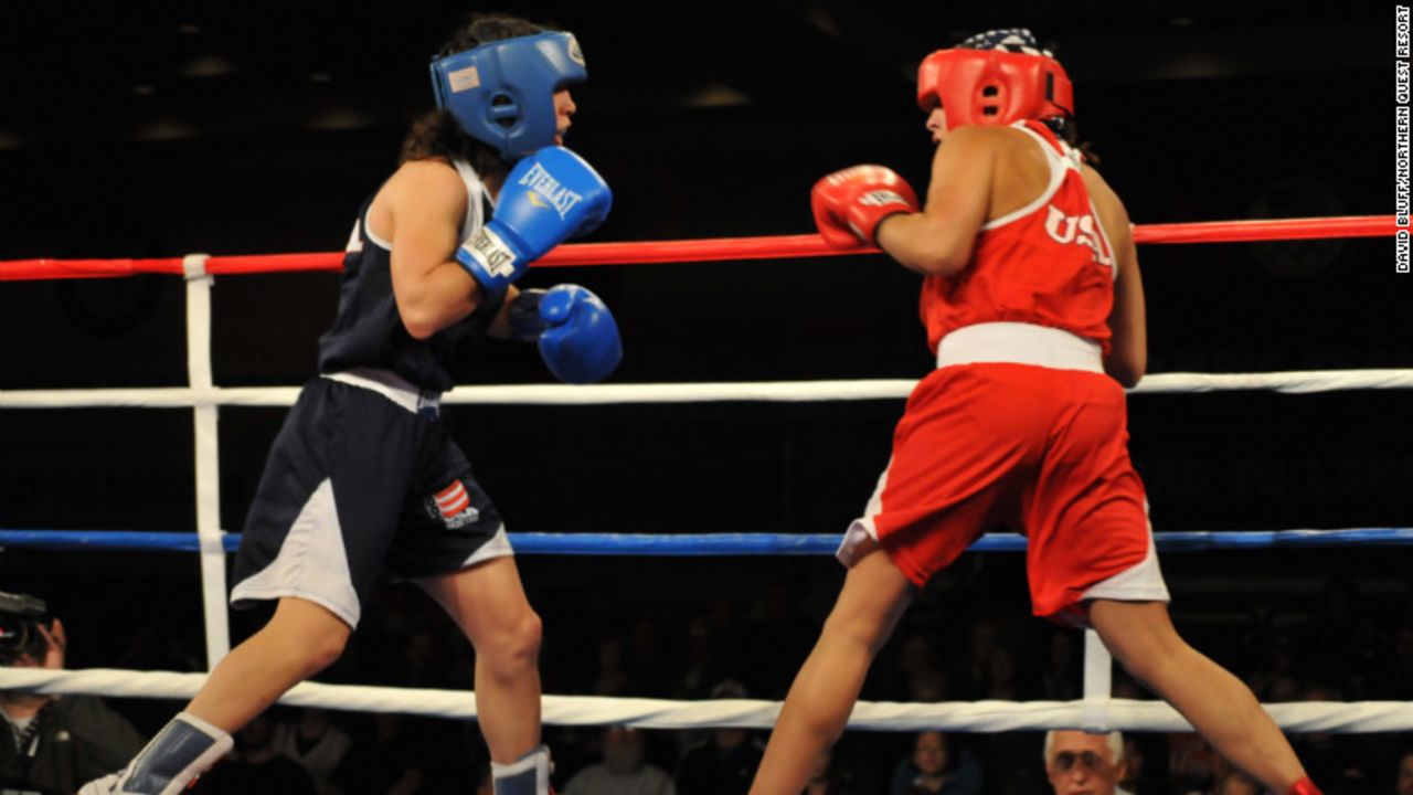 Marlen Esparza (Red) fought Alex Love (blue) from Monroe, Washington in the first round at the Olympic boxing trials. Her first opponent, Cynthia Moreno from Arizona, was medically excused for a sprained ankle and didn't join the competition.