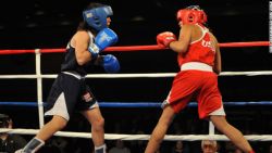 Marlen Esparza (Red) fought Alex Love (blue) from Monroe, Washington in the first round at the Olympic boxing trials. Her first opponent, Cynthia Moreno from Arizona, was medically excused for a sprained ankle and didn't join the competition.