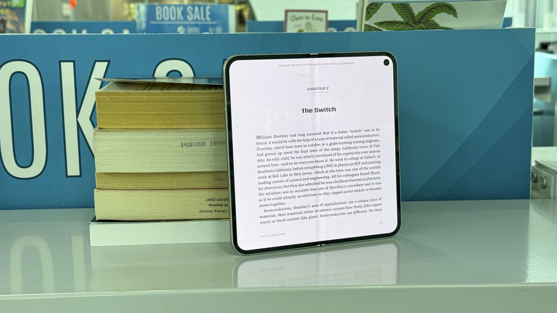 Pixel 9 Pro Fold in folded-out state showing a book on screen.