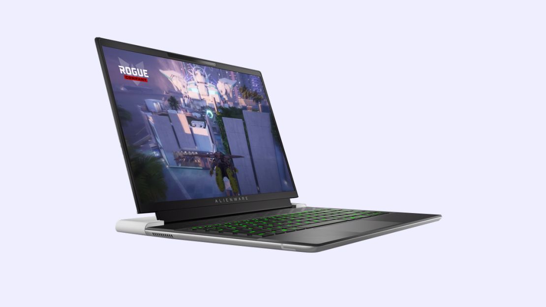 The Alienware x14 R2 laptop at a nearly 90 degree angle with a Rogue Company image on screen