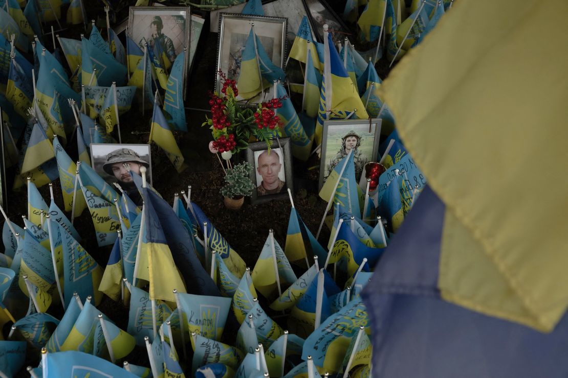 Ukrainian flags and portraits of soldiers are seen at a memorial for fallen fighters in Independence Square in Kyiv, Ukraine, on May 14.