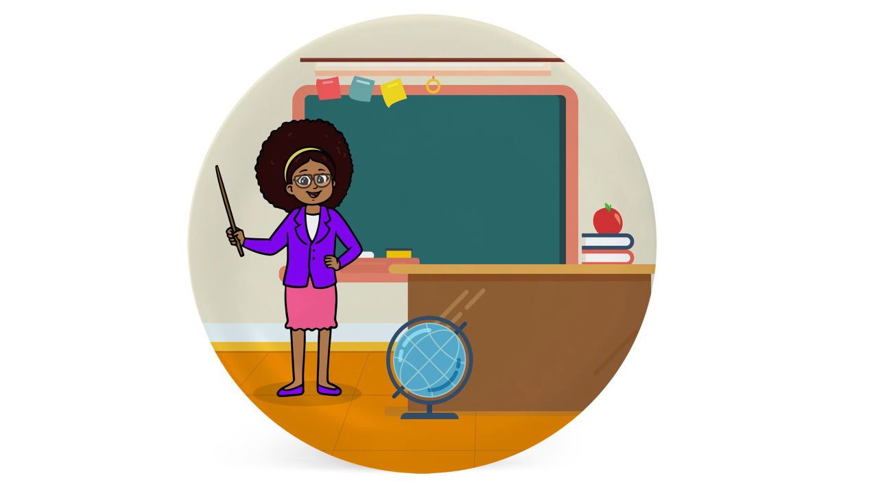 teacher in classroom in front of blackboard