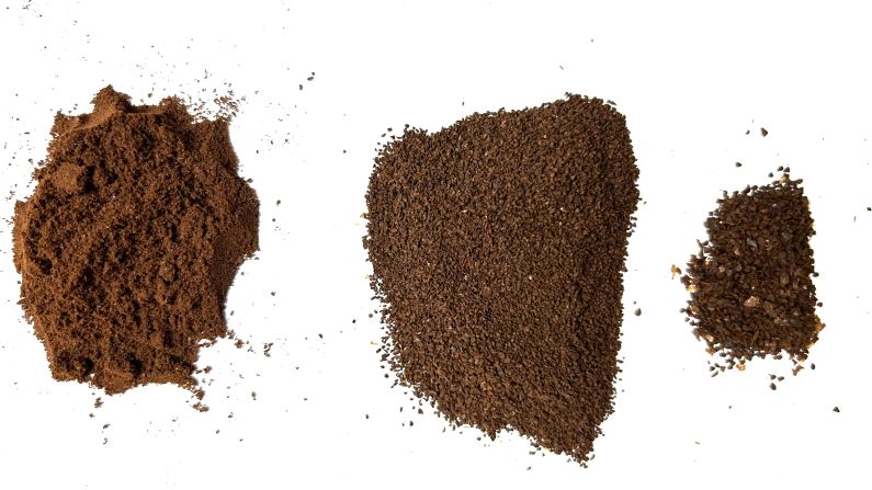 Three piles of coffee grounds from fine to coarse from the Comandante C40 MK4