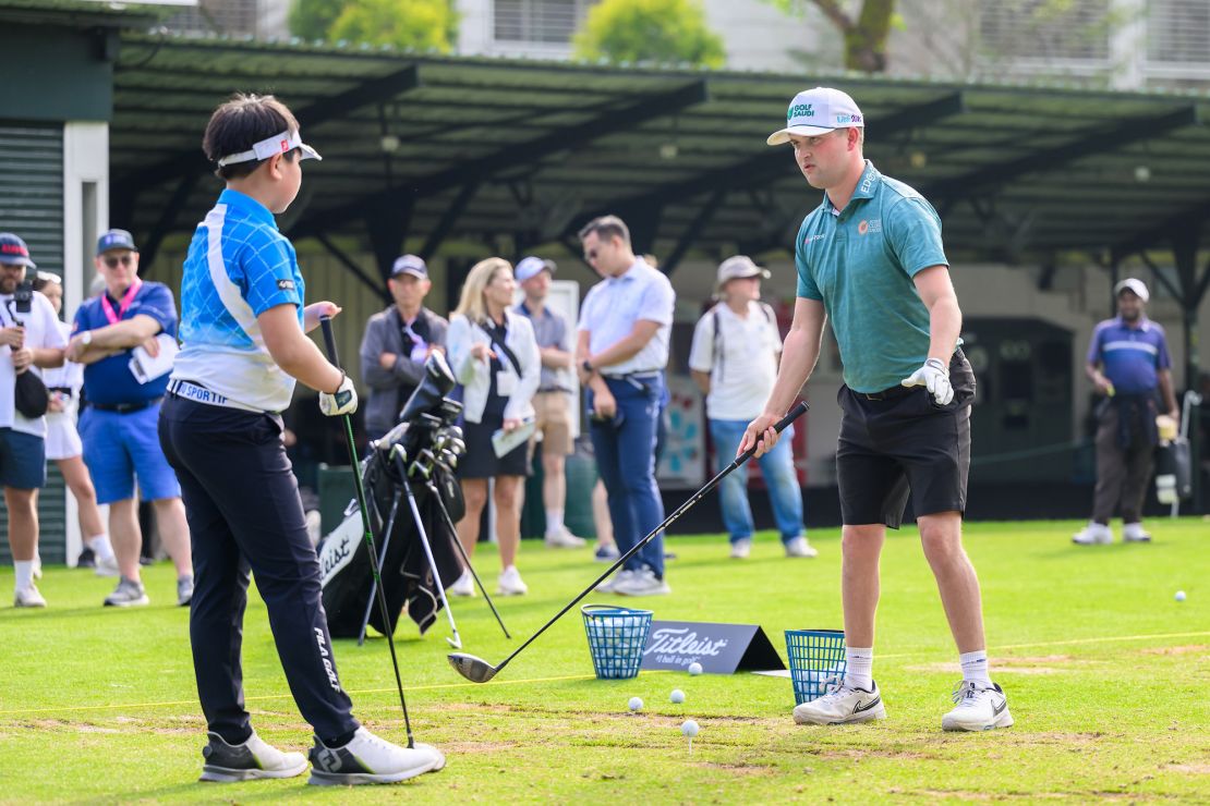 Popert gave Ma a masterclass in driving at the range.