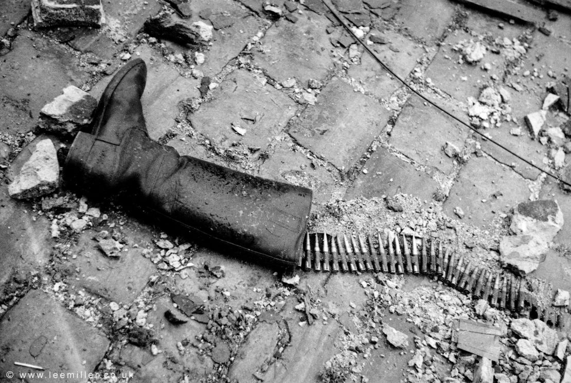 In the coastal town of Saint-Malo, France, where Allied and German forces clashed in 1944, Miller snapped an image of a tall boot on the ground, an ammunition belt snaking out like fish bones.