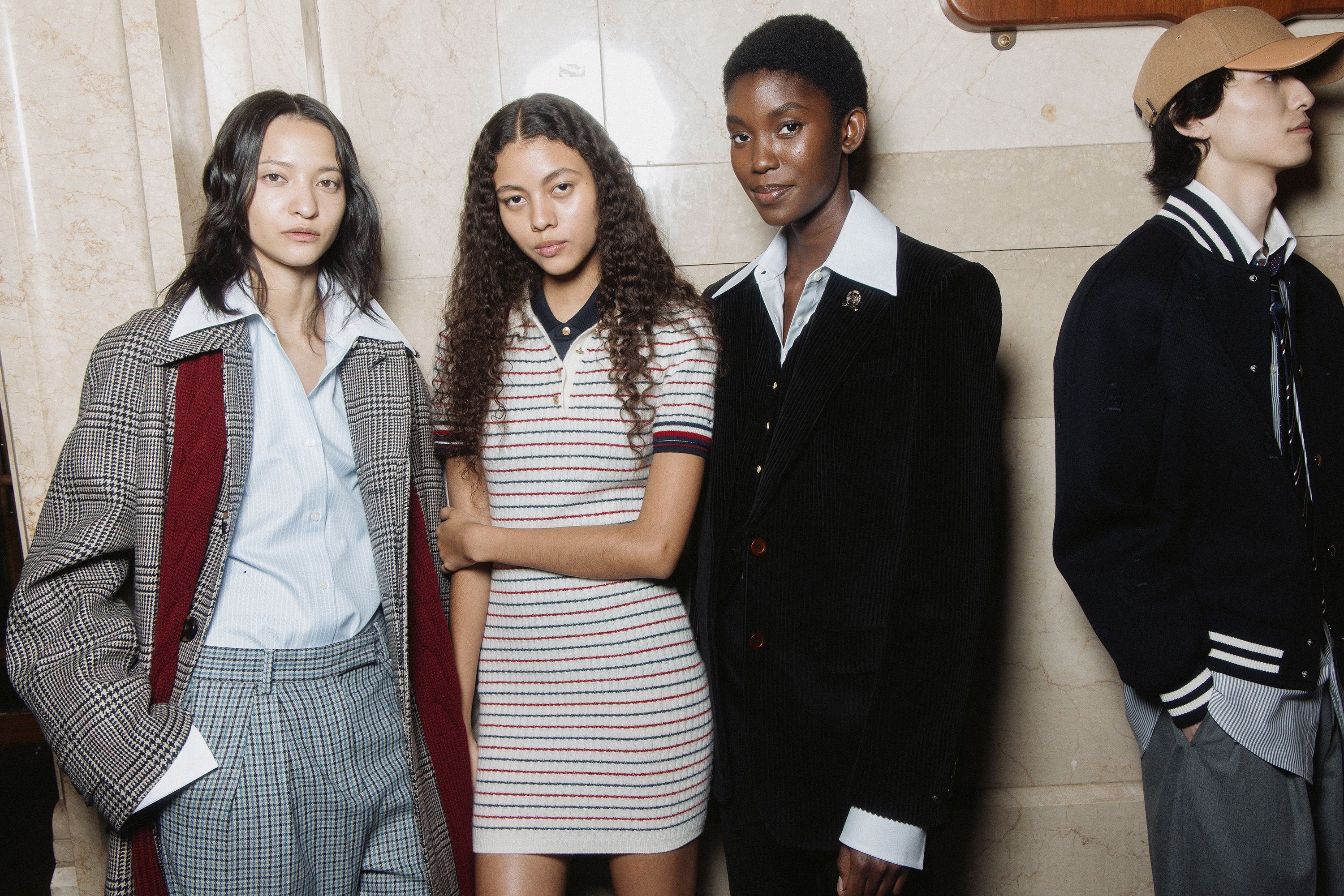 Models pose backstage during the Fall-Winter 2024 Tommy Hilfiger show. "It's Tommy’s Americana come to life," a press release from the brand said, "in shades of red, white, and blue that infuse the brand’s iconic DNA with modernity."