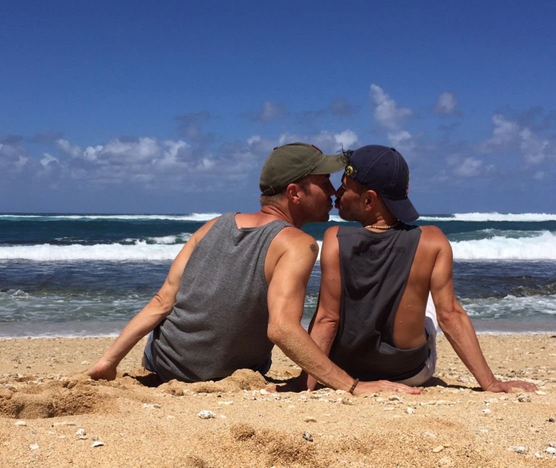 Larry and Guillermo, pictured here in Hawaii, got engaged on an airplane.