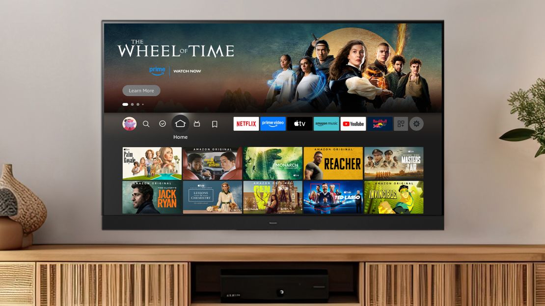 The Panasonic Z95A Fire TV has the Fire TV home screen in a well designed living room