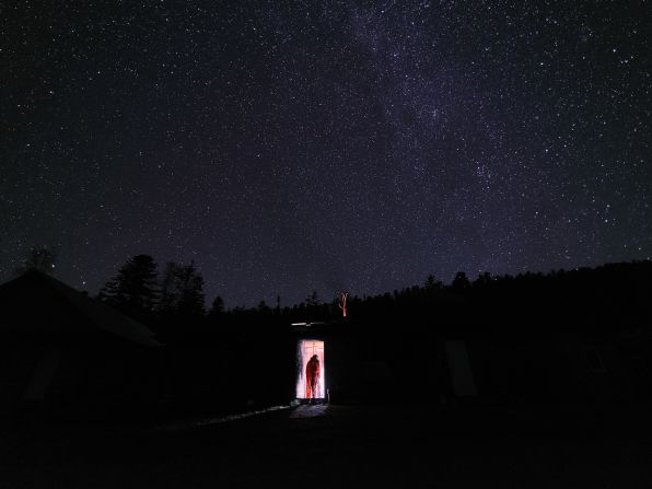 Jiayi Wang photographed a colleague from the China University of Geosciences entering a cabin in eastern Siberia against the dark backdrop of a starlit sky.