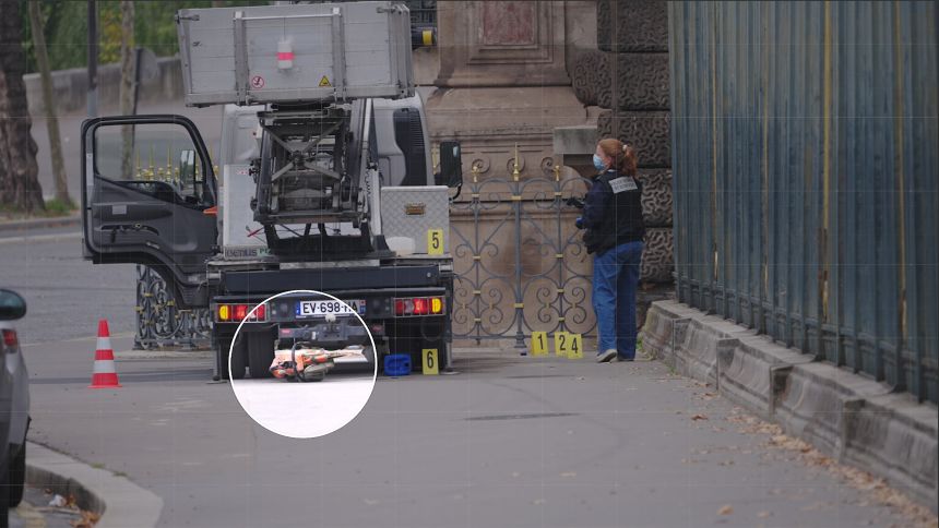 French police examine a angle grinder that thieves used in the Louvre robbery on Sunday.