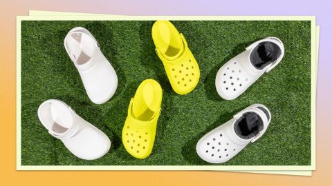 A photo of Crocs shoes on a grass background