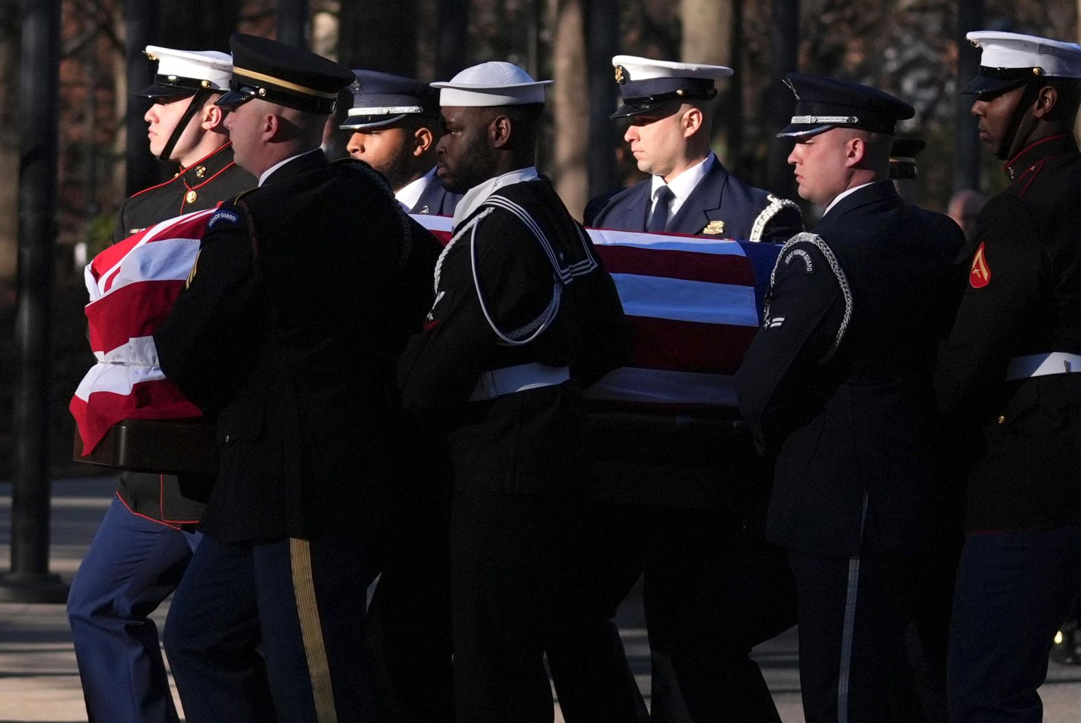 Military members carry the casket of former President Jimmy Carter into the Jimmy Carter Presidential Library and Museum, where Carter's casket will lie in repose on January 4, 2025, in Atlanta, Georgia.