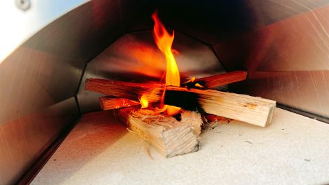 The Cru Oven Model 30 is very simple in design; you fuel it by building a fire at the rear of the chamber.